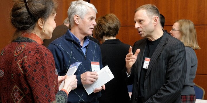 faculty members talking together
